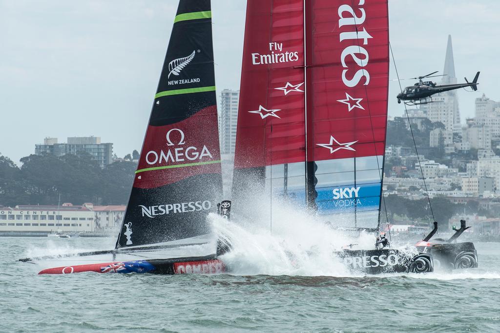 Emirates Team New Zealand bury the bows in the bear away at the top mark in their first race of the Louis Vuitton finals against Luna Rossa Challenge. Rob Waddell and Chris Ward were lost over board.17/8/2013 © Chris Cameron/ETNZ http://www.chriscameron.co.nz