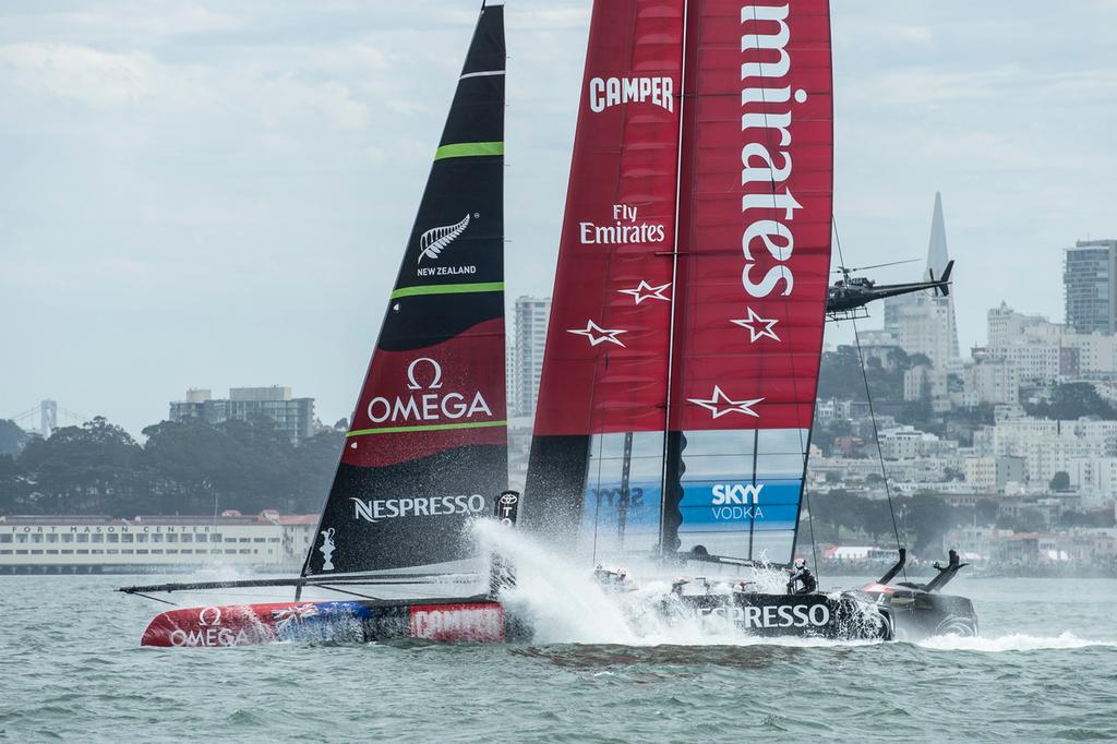 Emirates Team New Zealand bury the bows in the bear away at the top mark in their first race of the Louis Vuitton finals against Luna Rossa Challenge. Rob Waddell and Chris Ward were lost over board.17/8/2013 © Chris Cameron/ETNZ http://www.chriscameron.co.nz