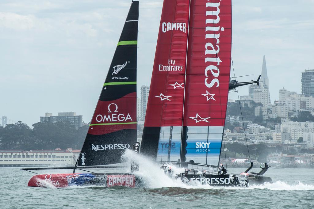 Emirates Team New Zealand bury the bows in the bear away at the top mark in their first race of the Louis Vuitton finals against Luna Rossa Challenge. Rob Waddell and Chris Ward were lost over board.17/8/2013 © Chris Cameron/ETNZ http://www.chriscameron.co.nz