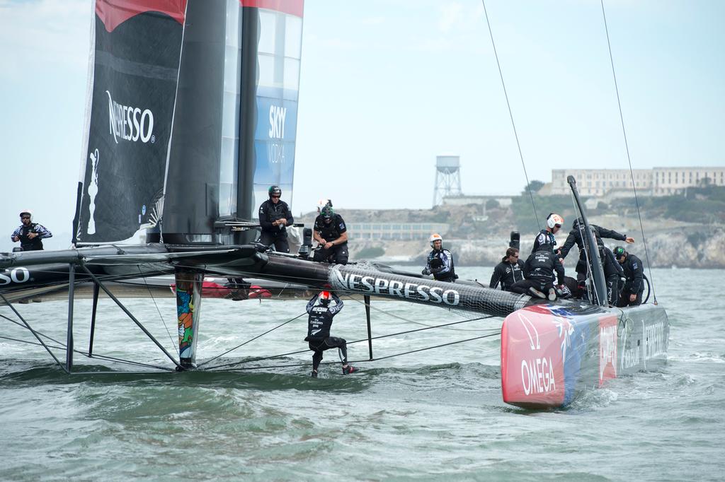 Emirates Team New Zealand remove the fairing broken and fit a temporary tramp in preparation for racing the second race of the Louis Vuitton finals against Luna Rossa Challenge. .17/8/2013 © Chris Cameron/ETNZ http://www.chriscameron.co.nz