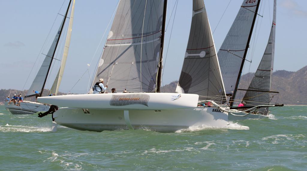 Carbon Credit flying past the monohulls at the top mark photo copyright SeaLink Magnetic Island Race Week Media SMIRW taken at  and featuring the  class