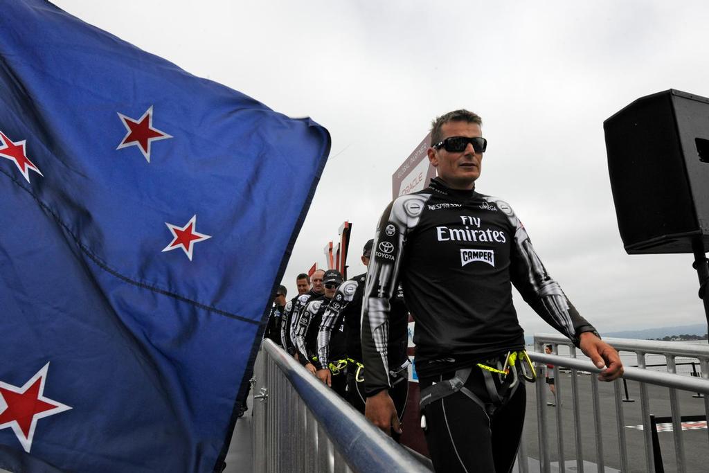 Dean Barker, skipper of Emirates Team New Zealand and his mates, walk off the stage at the Dock Out show and on to winning the 6th Match Race of the Louis Vuitton Cup Finale on August 23, 2013 in San Francisco California. photo copyright  SW taken at  and featuring the  class