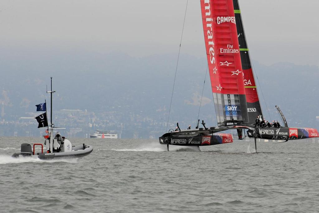 The Umpires keep a close watch on Team New Zealand at the Louis Vuitton Cup Final in San Francisco California on August 23, 2013. ©  SW