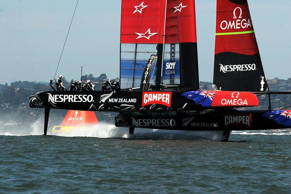 Emirates Team New Zealand round the reach mark first, in match race 4 at the Loui Vuitton Cup in San Francisco California on August 21, 2013.  ©  SW