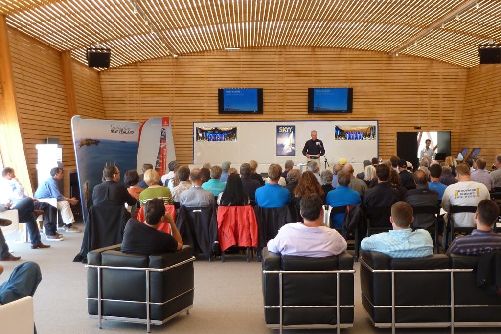 NZ Marine's Peter Busfield speaks to guests and media at Emirates Team New Zealand's base in San Francisco - America's Cup photo copyright NZ Trade & Enterprise Representative taken at  and featuring the  class