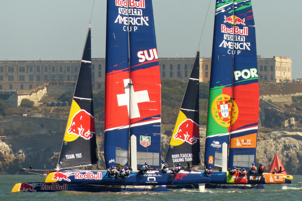 Switzerland and Portugal going upwind past Alcatraz Island. - Red Bull Youth AC © John Navas 