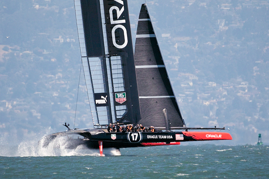 Oracle flies on her foils, showing their shorter headsail.  - America’s Cup © Chuck Lantz http://www.ChuckLantz.com