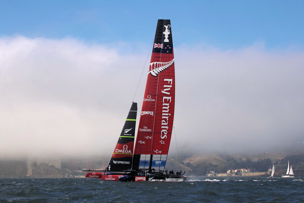 Emirates Team New Zealand, against a foggy background and blue sky. - America’s Cup © Chuck Lantz http://www.ChuckLantz.com