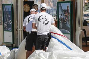 Crew members of Lupa of London (GBR) during sail measurement on Piazza Azzurra - 2013 Maxi Yacht Rolex Cup photo copyright  Rolex / Carlo Borlenghi http://www.carloborlenghi.net taken at  and featuring the  class