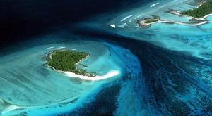 ENVIRONMENT WARMING...A FILE PHOTO OF TARAWA KIRIBATI  IN THE SOUTH PACIFIC...An aerial view shows Tarawa, Kiribati, South Pacific in this 1978 file photo. The earth's atmosphere is warming faster than expected and evidence is mounting that human activity is responsible, the United Nations Environment Programme said January 22, 2001. The U.N.'s Intergovernmental Panel on Climate Change (IPCC) now projects the earth's average surface temperature will rise 1.4 to 5.8 degrees Celsius between 1990 a photo copyright  SW taken at  and featuring the  class
