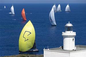 Super Maxi and J Classes sail pass Capo Ferro during the first day of racing - 2013 Maxi Yacht Rolex Cup photo copyright  Rolex / Carlo Borlenghi http://www.carloborlenghi.net taken at  and featuring the  class