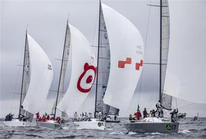 The Rolex Farr 40 Worlds 2013 fleet under spinnaker on the first day of racing - 2013 Rolex Farr 40 World Championship photo copyright  Rolex/Daniel Forster http://www.regattanews.com taken at  and featuring the  class