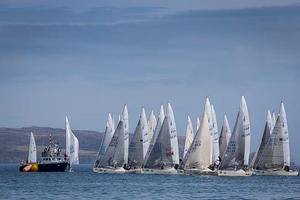 Howth Yacht Club, Co. Dublin, Ireland; Tuesday 27th August 2013: The fleet of 40 boats at the start racing off Howth on day two of the BMW J24 World Championships before racing was abandoned due to lack of wind.  The programme will continue for the rest of the week until Friday's final when fresher conditions have been forecast. photo copyright David Branigan/Oceansport http://www.oceansport.ie/ taken at  and featuring the  class