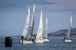 Howth Yacht Club, Co. Dublin, Ireland; Tuesday 27th August 2013: Bob Turner's Serco leading a group of boats towards the windward mark off Howth on day two of the BMW J24 World Championships before racing was abandoned due to lack of wind.  The programme will continue for the rest of the week until Friday's final when fresher conditions have been forecast. photo copyright David Branigan/Oceansport http://www.oceansport.ie/ taken at  and featuring the  class