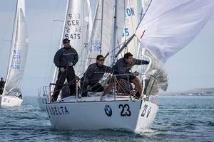 Howth Yacht Club, Co. Dublin, Ireland; Tuesday 27th August 2013: Peruvian entry Scaramoush skippered by Luis Olcese at the windward mark off Howth on day two of the BMW J24 World Championships before racing was abandoned due to lack of wind.  The programme will continue for the rest of the week until Friday's final when fresher conditions have been forecast. photo copyright David Branigan/Oceansport http://www.oceansport.ie/ taken at  and featuring the  class
