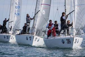 Howth Yacht Club, Co. Dublin, Ireland; Tuesday 27th August 2013: German entry JJ-One leading a group of boats towards the windward mark off Howth on day two of the BMW J24 World Championships before racing was abandoned due to lack of wind.  The programme will continue for the rest of the week until Friday's final when fresher conditions have been forecast. photo copyright David Branigan/Oceansport http://www.oceansport.ie/ taken at  and featuring the  class