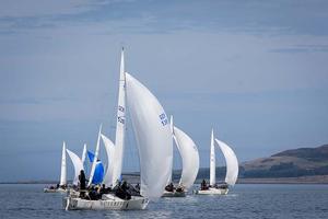 Howth Yacht Club, Co. Dublin, Ireland; Tuesday 27th August 2013: Fleet racing off Howth on day two of the BMW J24 World Championships before racing was abandoned due to lack of wind.  The programme will continue for the rest of the week until Friday's final when fresher conditions have been forecast. photo copyright David Branigan/Oceansport http://www.oceansport.ie/ taken at  and featuring the  class