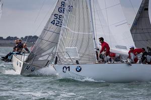 Howth Yacht Club, Co. Dublin, Ireland; Wednesday 28th August 2013: Defending world champion Mauricio Santa Cruz from Rio de Janeiro and his crew on Bruschetta slip in ahead of Jim Anderson's Boomerang during yesterday's racing in the BMW J24 World Championships at Howth Yacht Club. photo copyright David Branigan/Oceansport http://www.oceansport.ie/ taken at  and featuring the  class