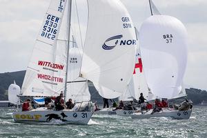 Howth Yacht Club, Co. Dublin, Ireland; Wednesday 28th August 2013: Event leader Mauricio Santa Cruz (right) leads a group of boats in race 4 of the BMW J24 World Championships at Howth Yacht Club. photo copyright David Branigan/Oceansport http://www.oceansport.ie/ taken at  and featuring the  class