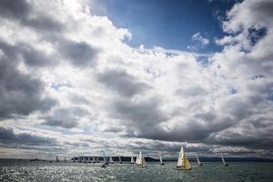 Howth Yacht Club, Co. Dublin, Ireland; Thursday 29th August 2013: Dark clouds over the course area off Ireland's Eye brought shifting winds to the 40 boat fleet racing in the BMW J24 World Championships at Howth Yacht Club yesterday (Thursday). photo copyright David Branigan/Oceansport http://www.oceansport.ie/ taken at  and featuring the  class