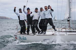 Howth Yacht Club, Co. Dublin, Ireland; Friday 30th August 2013: Tim Healy (left) and the crew of Helly Hansen from Sail Newport (USA) on their way to overall victory on the final day of the BMW J24 World Championships at Howth Yacht Club. photo copyright David Branigan/Oceansport http://www.oceansport.ie/ taken at  and featuring the  class