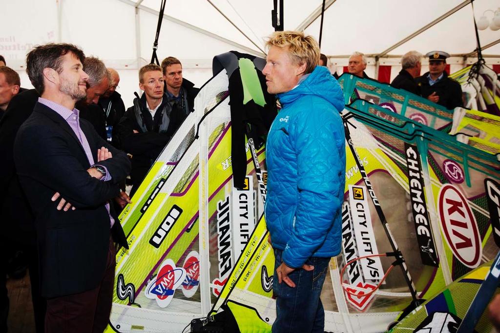 Crown Prince Frederik of Denmark and German windsurfing champion Klaas Voget talk windsurfing. The Crown Prince, an accomplished sailor, former Danish Navy seal and iron man triathlete was talking to best windsurfers in the world after trying it out for himself in the morning on the eve of the 2013 KIA Cold Hawaii world cup in KlitmÃ¸ller. photo copyright  John Carter / PWA http://www.pwaworldtour.com taken at  and featuring the  class