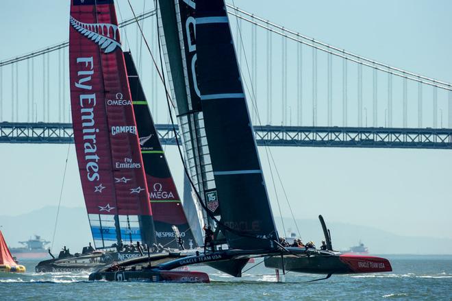 Oracle Team USA round the bottom mark ahead of Emirates Team New Zealand in race 16 on day 13 of America’s Cup 34. 23/9/2013 © Chris Cameron/ETNZ http://www.chriscameron.co.nz