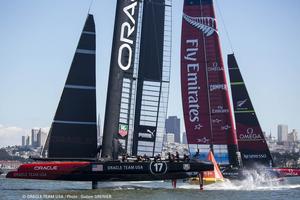 Oracle team USA and Emirates team NewZealand in action photo copyright Oracle Team USA http://www.oracleteamusa.com taken at  and featuring the  class