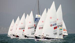 Laser Fleet - 2013 ISAF Sailing World Cup Qingdao Day 3 photo copyright ISAF  taken at  and featuring the  class