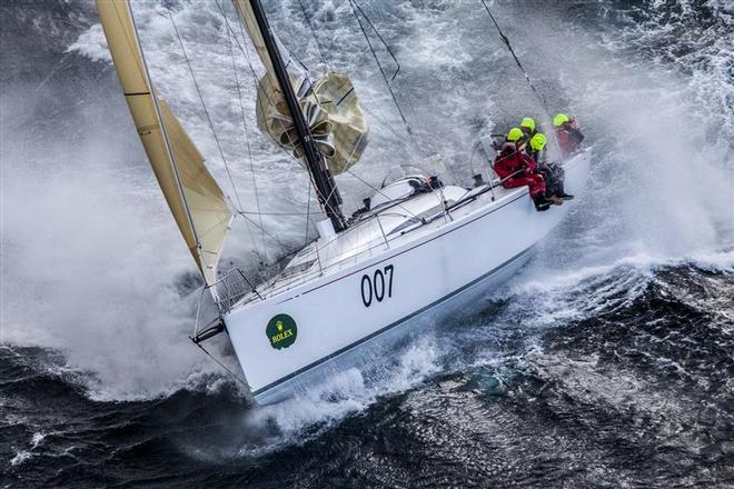 Pretty Fly III, with Peter Burling, as a helmsman cresting the big seas passing Tasman Island - 2013 Rolex Sydney Hobart ©  Rolex/Daniel Forster http://www.regattanews.com