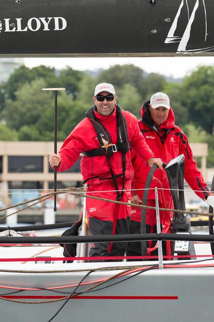 Skipper Mark Richards, waves ownder Bob Oatley’s lucky walking stick after winning Line honours in the 2013 Rolex Sydney to Hobart © Andrea Francolini