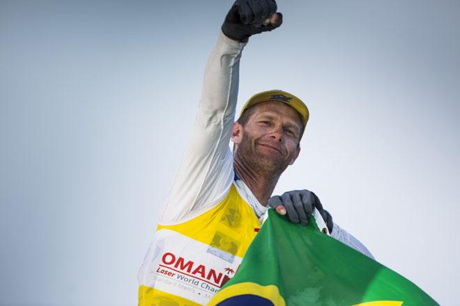 The Laser World Championships 2013 - Standard. Mussanah Oman The final day of racing, Robert Scheidt (BRA) shown here celebrating after winning the championships © Lloyd Images