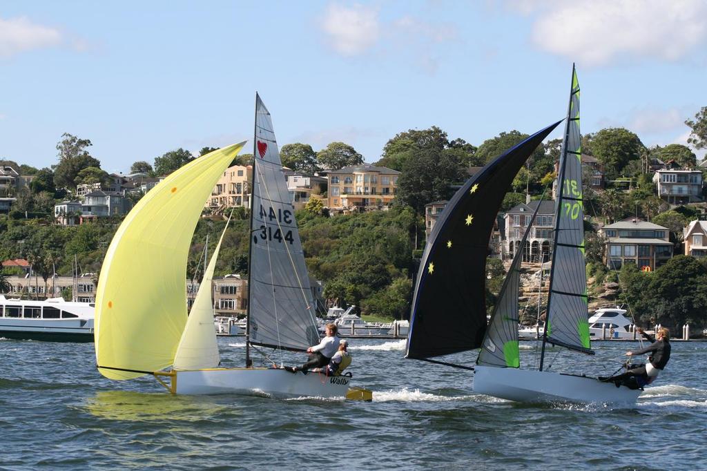 Kirk Mitchell and Andrew Stephenson (right) roll over the top of their closest rivals Trevor Fay and Morgan Frew - 2013-14 NSW Cherub State Championships photo copyright Carol Stephenson taken at  and featuring the  class