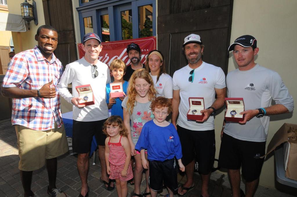Photo 01970136: Winners receive signature timepieces from Cardow Jewelers: L to R: Awards Presenter, Julius Jackson, Don Wilson, Teddy Nicolosi, Josh McCaffrey, Amanda Engeman, Willem van Waay, Jordan Reece. Standing in front, Wilson’s children Annabel, Ava and Oliver. photo copyright Dean Barnes taken at  and featuring the  class