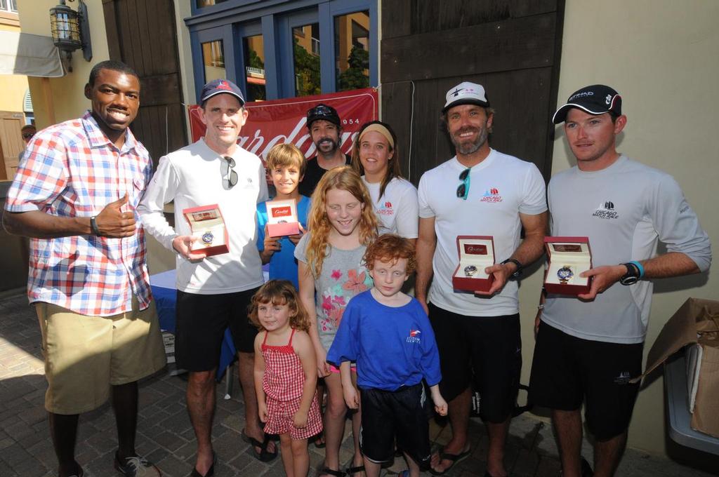 Photo 01970136: Winners receive signature timepieces from Cardow Jewelers: L to R: Awards Presenter, Julius Jackson, Don Wilson, Teddy Nicolosi, Josh McCaffrey, Amanda Engeman, Willem van Waay, Jordan Reece. Standing in front, Wilson’s children Annabel, Ava and Oliver. © Dean Barnes