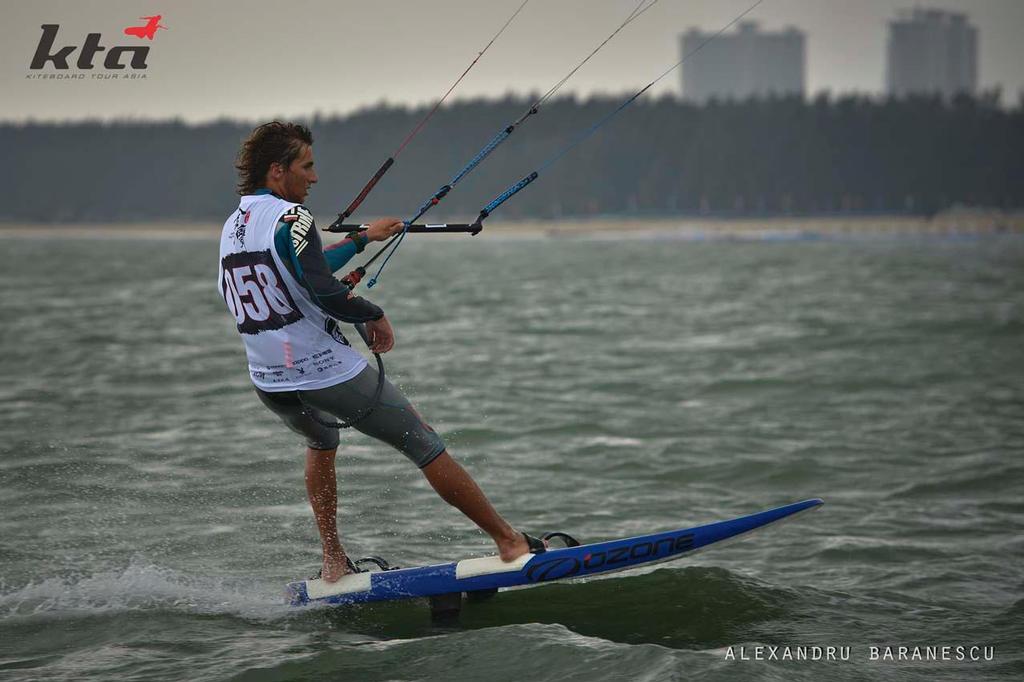 Florian Gruber from Germany in action during day two of the IKA Kiteboard Race World Championship 2013 on November 21, 2013 at King Bay Qionghai, China. © Alexandru Baranescu
