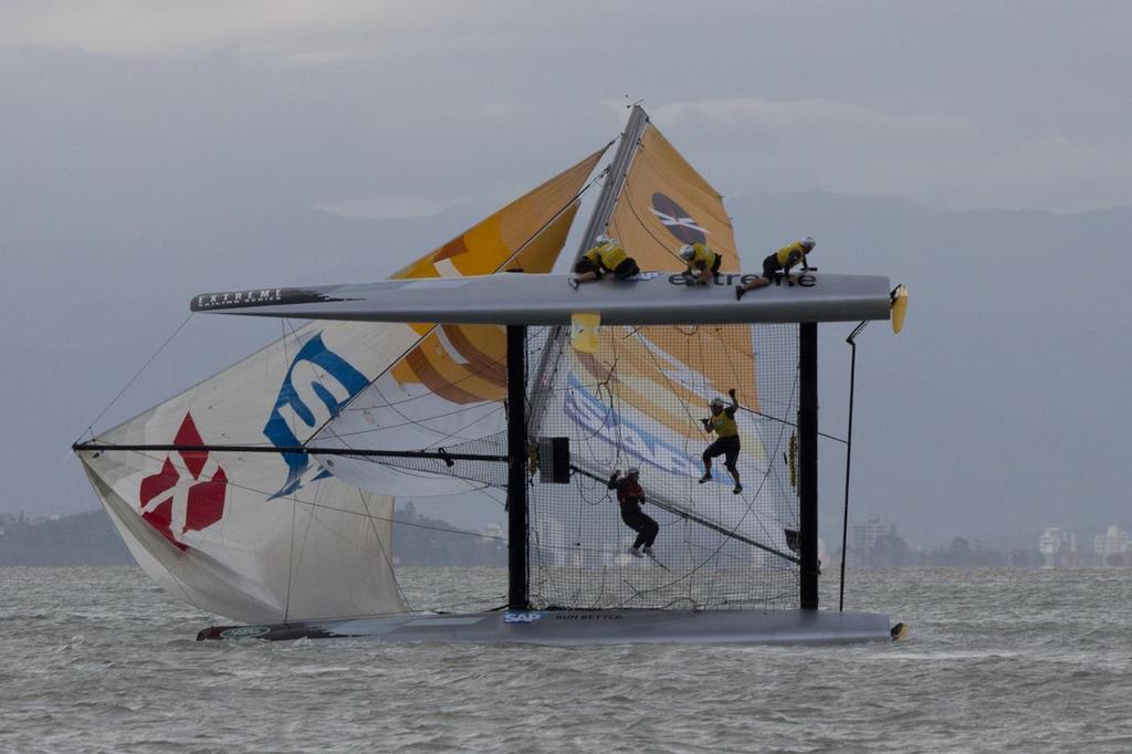 SAP Extreme Sailing Team capizes in Act 8 of the Extreme Sailing Series © Søren Wiegand Kristensen