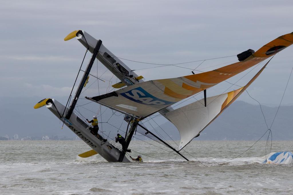 SAP Extreme Sailing Team capizes in Act 8 of the Extreme Sailing Series © Søren Wiegand Kristensen