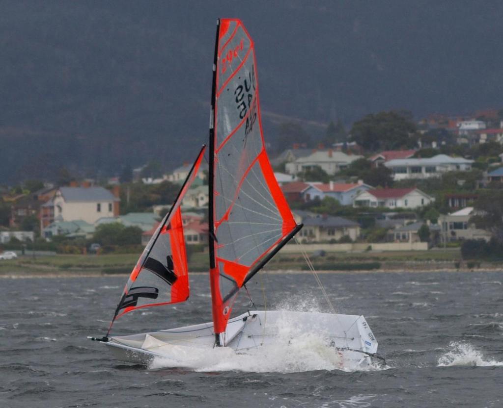 This 29er seems to have lost its crew as the fleet was hit by a south-westerly front. © Jane Austin