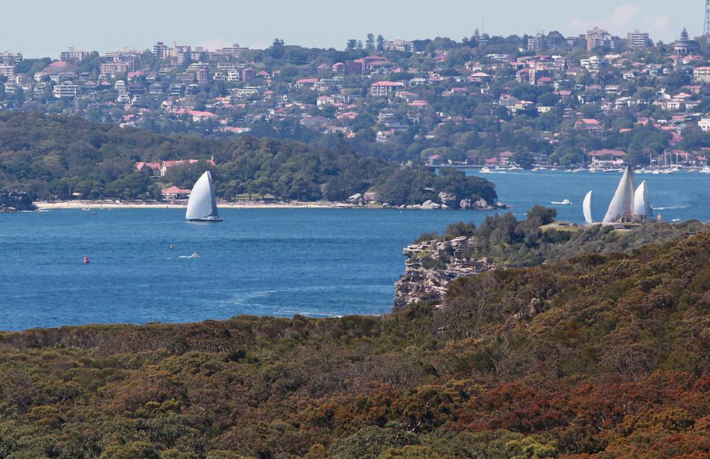 Ichi Ban gets an early lead, ghosting down the eastern shore from the start, before getting stranded mid-harbour, with no breeze. photo copyright Crosbie Lorimer http://www.crosbielorimer.com taken at  and featuring the  class