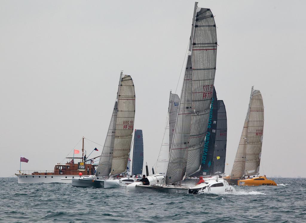 Power start from the Firefly class. Phuket King’s Cup 2013. © Guy Nowell