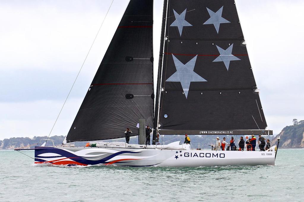 Jim Delegat's Volvo 70, Giacomo (the former Groupama 3) watches the match between  Team Australia (Sean Langman) in their match against  TeamVodafoneSailing (Simon Hull) on the Waitemata Harbour, Wednesday October 23, 2013. Team Australia will line up for the 2013 Coastal Classic photo copyright Richard Gladwell www.photosport.co.nz taken at  and featuring the  class