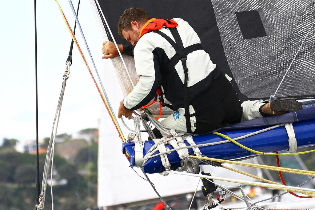 Crew member working on Team Australia before the Start of Coastal Classic 2013, Waitemata Harbour, October 25, 2013 photo copyright Richard Gladwell www.photosport.co.nz taken at  and featuring the  class