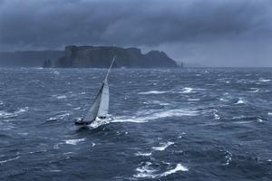 Nikata cresting the big seas passing Tasman Island - 2013 Rolex Sydney Hobart photo copyright  Rolex / Carlo Borlenghi http://www.carloborlenghi.net taken at  and featuring the  class