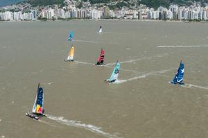 The fleet race against the city backdrop of Florianopolis, a new stadium racecourse for 2013 photo copyright  Vincent Curutchet / Dark Frame http://www.extremesailingseries.com/ taken at  and featuring the  class
