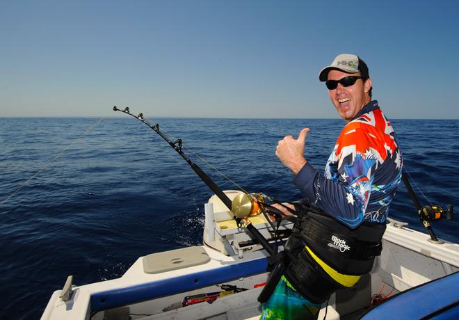 Hooked up and harnessed in to a nice blue on a rare gloriously flat calm December day. Life doesn’t get much better!  © Jarrod Day