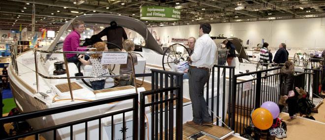 Visitors looking at the Sun Odyssey yachts on the Jeanneau stand at the London Boat Show 2014, ExCeL, London. © onEdition http://www.onEdition.com