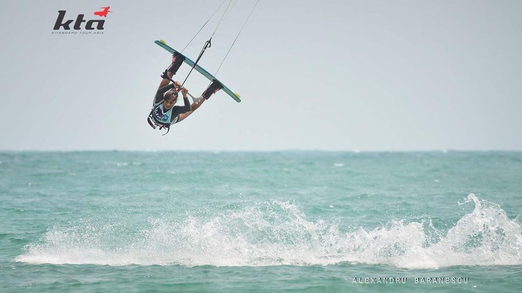 Kiteboarders ripping over clear waters of South China Sea in tight racing in lightening winds - KTA Indonesia 2014 © Alexandru Baranescu