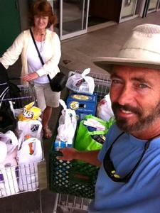 Sheryl and Paul Shard provisioning in St. Maarten in the Caribbean where good grocery stores make it easy. photo copyright Sheryl Shard taken at  and featuring the  class