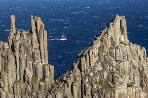 Midnight Rambler passing Tasman Island - Rolex Sydney to Hobart 2013 photo copyright  Rolex/Daniel Forster http://www.regattanews.com taken at  and featuring the  class